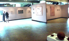 Temporry group exhibit at Mobile Trailer Supply in Mountainview w' curator Sheila Wynne and helper Buzz Schwall